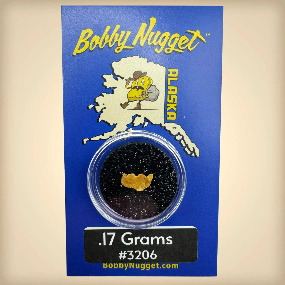 Bobby Nugget Alaska gold nugget packaging with blue background and gold nugget inside.