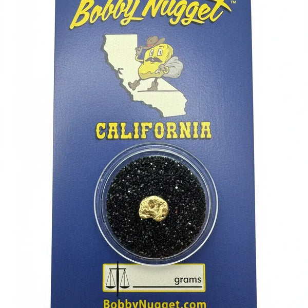Authentic 1-gram gold nugget safely encased with a branded blue Bobby Nugget card  