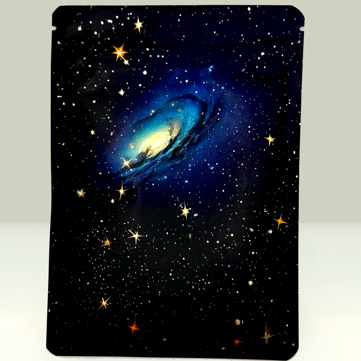 Space-themed gold paydirt with galaxy and stars design on a black background
